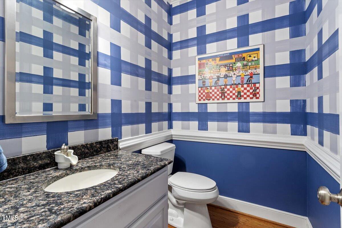 12329 Whartons Way Raleigh, NC 27613 - Photo 13 of 51 a bathroom with a granite countertop sink and a toilet