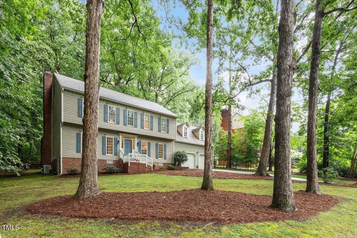 12329 Whartons Way Raleigh, NC 27613 - Photo 2 of 51 a view of a yard in front of a white house