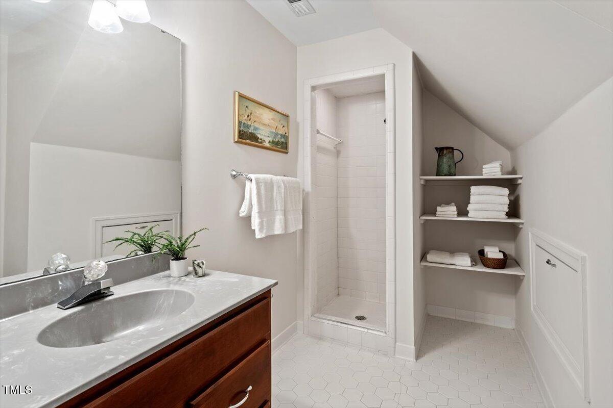12329 Whartons Way Raleigh, NC 27613 - Photo 27 of 51 a bathroom with a sink and a mirror