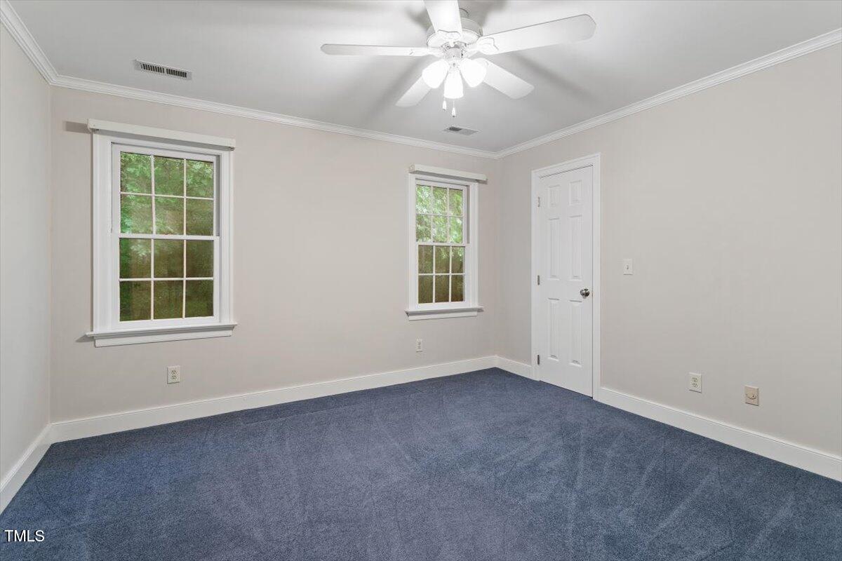 12329 Whartons Way Raleigh, NC 27613 - Photo 28 of 51 an empty room with a window and a fan