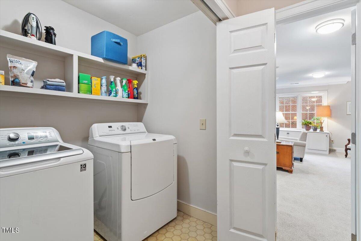 12329 Whartons Way Raleigh, NC 27613 - Photo 32 of 51 a view of storage and utility room with washer and dryer