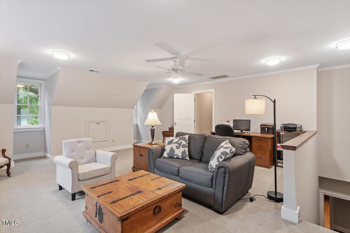 12329 Whartons Way Raleigh, NC 27613 - Photo 33 of 51 a living room with furniture and a lamp