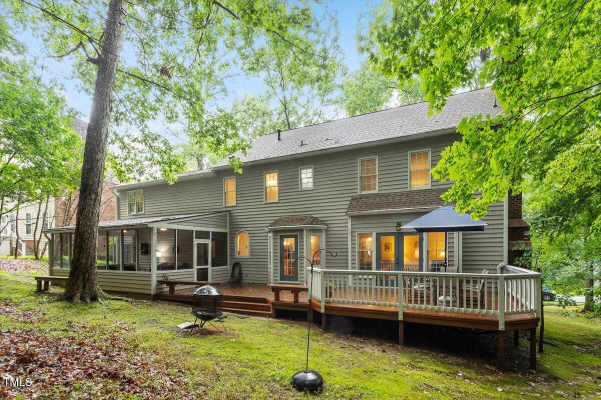 12329 Whartons Way Raleigh, NC 27613 - Photo 39 of 51 a view of a house with a deck and a yard