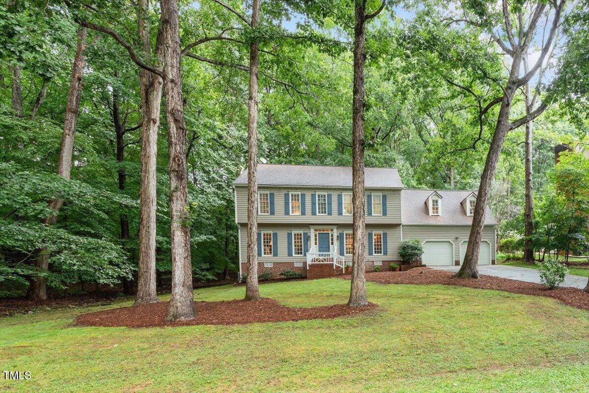 12329 Whartons Way Raleigh, NC 27613 - Photo 40 of 51 a view of a house with a yard and a large tree