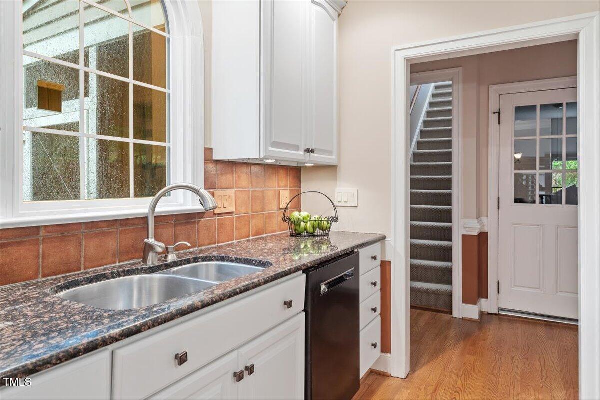 12329 Whartons Way Raleigh, NC 27613 - Photo 10 of 51 a kitchen with granite countertop a sink and a window