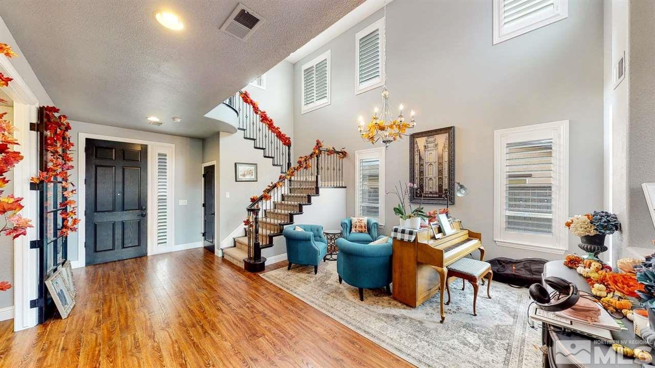 671 Caspian Court Reno, NV 89521 - Photo 2 of 33 a living room with furniture and wooden floor