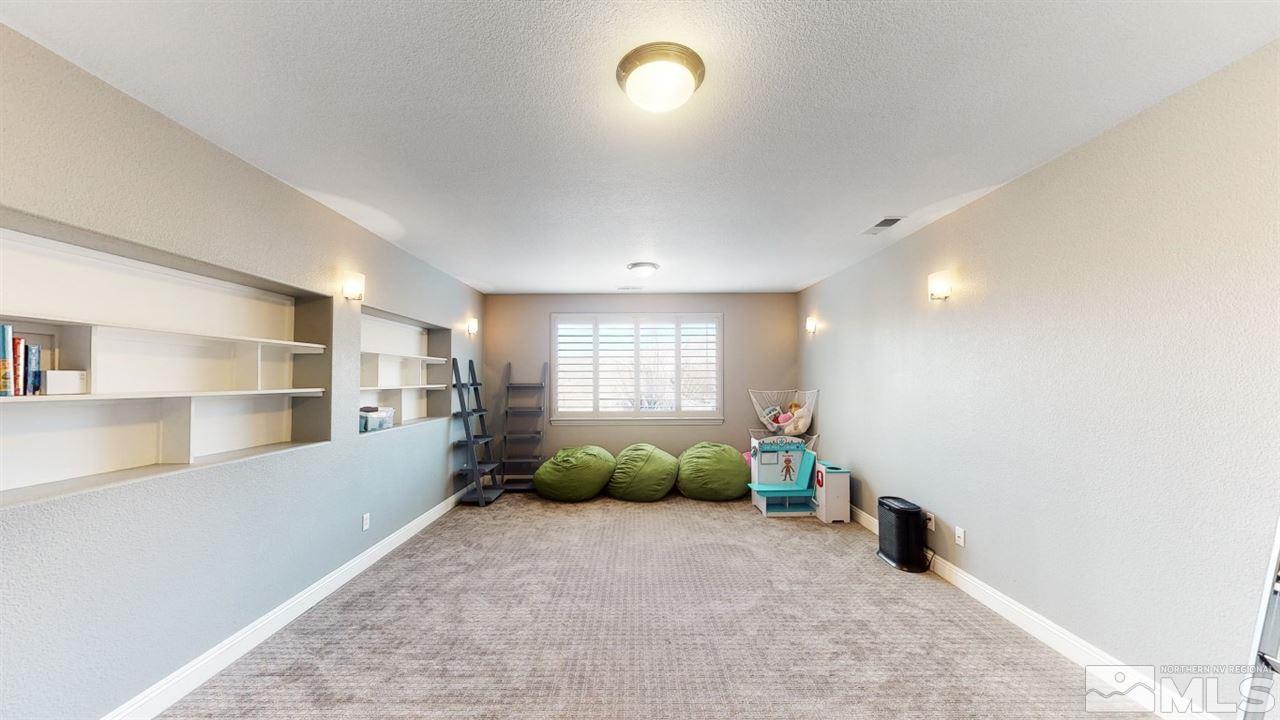 671 Caspian Court Reno, NV 89521 - Photo 22 of 33 a large room with windows