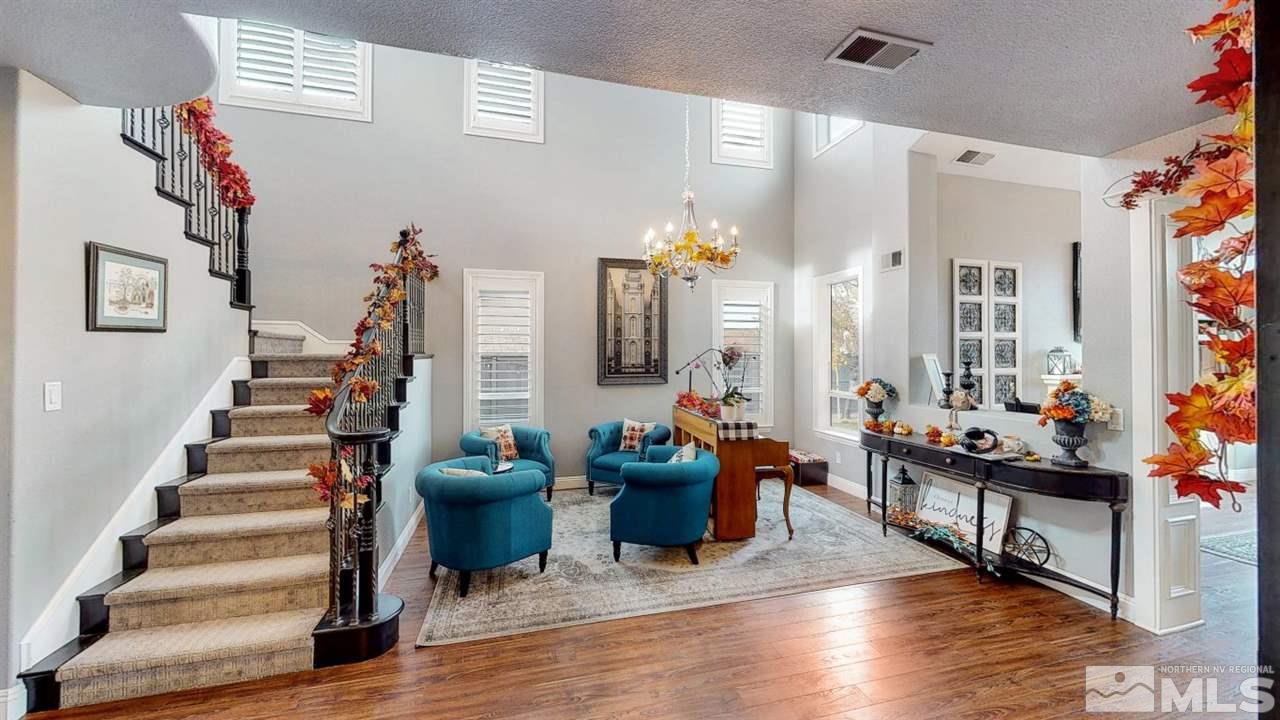 671 Caspian Court Reno, NV 89521 - Photo 3 of 33 a living room with furniture and wooden floor