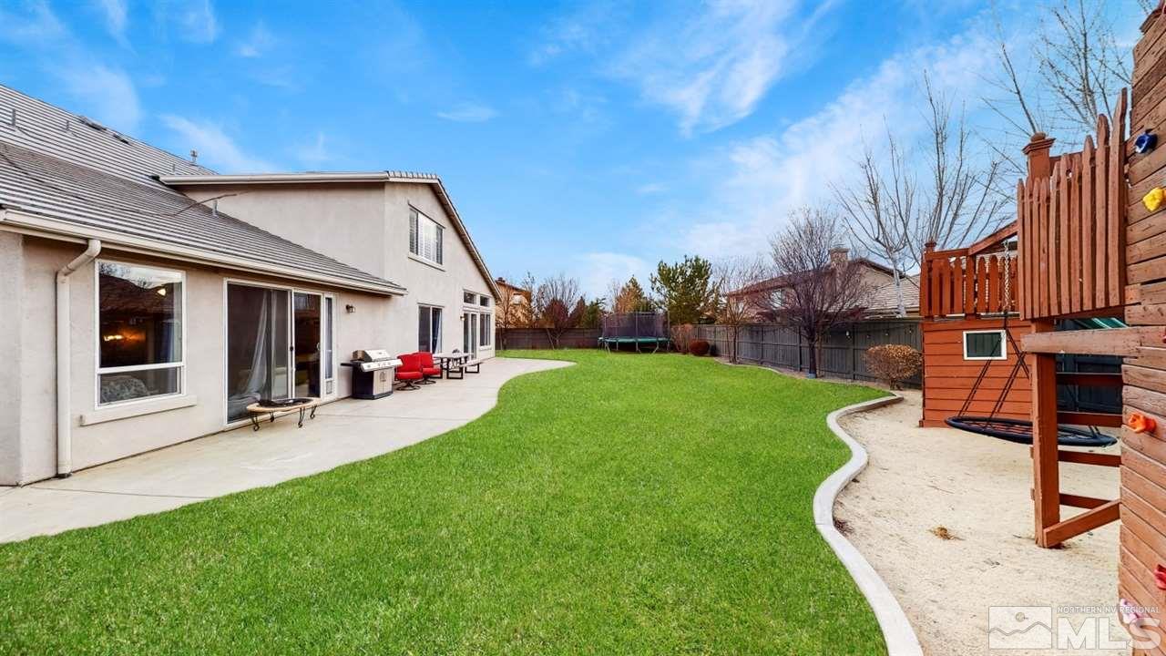 671 Caspian Court Reno, NV 89521 - Photo 32 of 33 a view of a house with backyard and porch