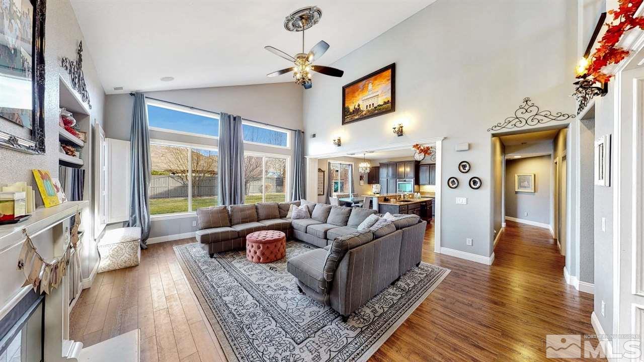 671 Caspian Court Reno, NV 89521 - Photo 5 of 33 a living room with furniture fireplace and a flat screen tv