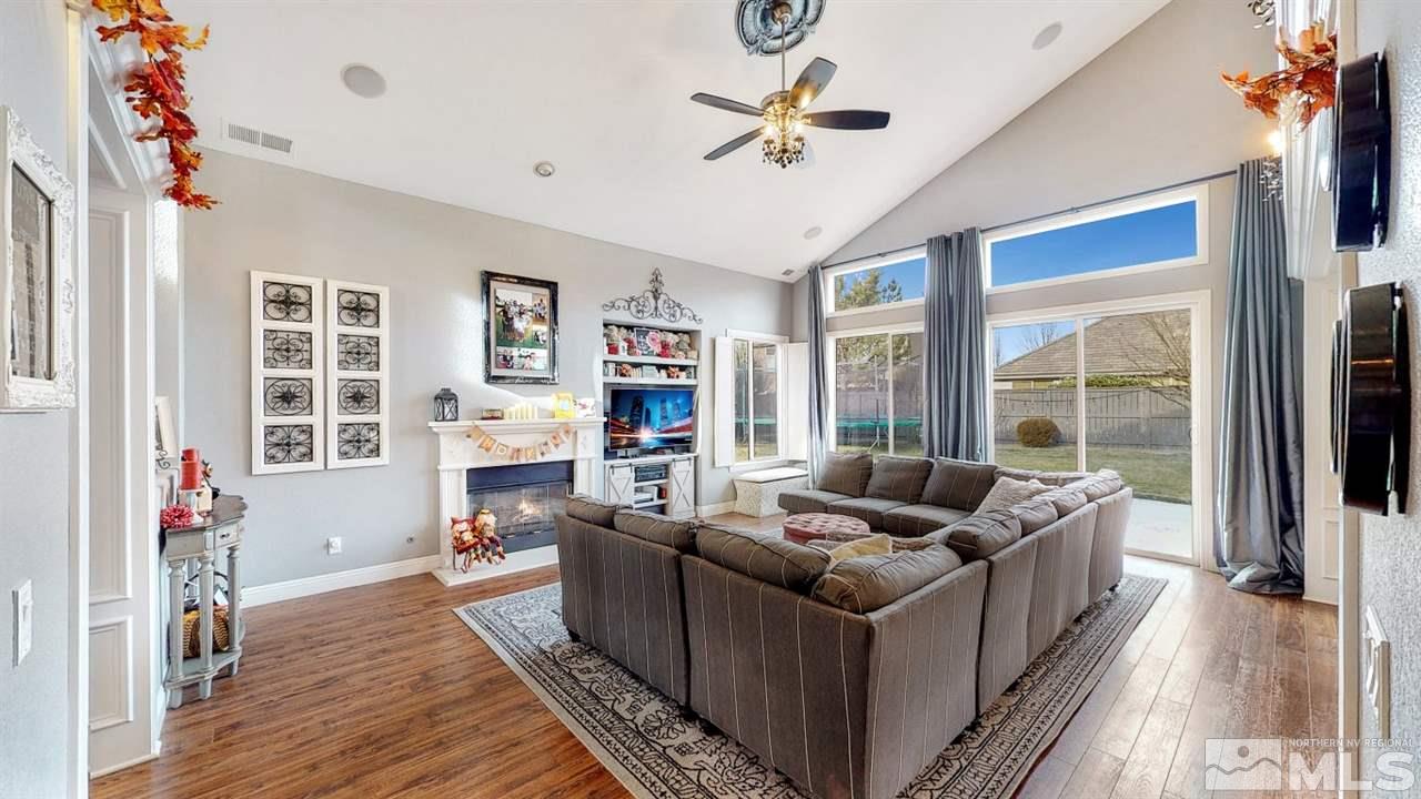 671 Caspian Court Reno, NV 89521 - Photo 6 of 33 a living room with furniture and a flat screen tv