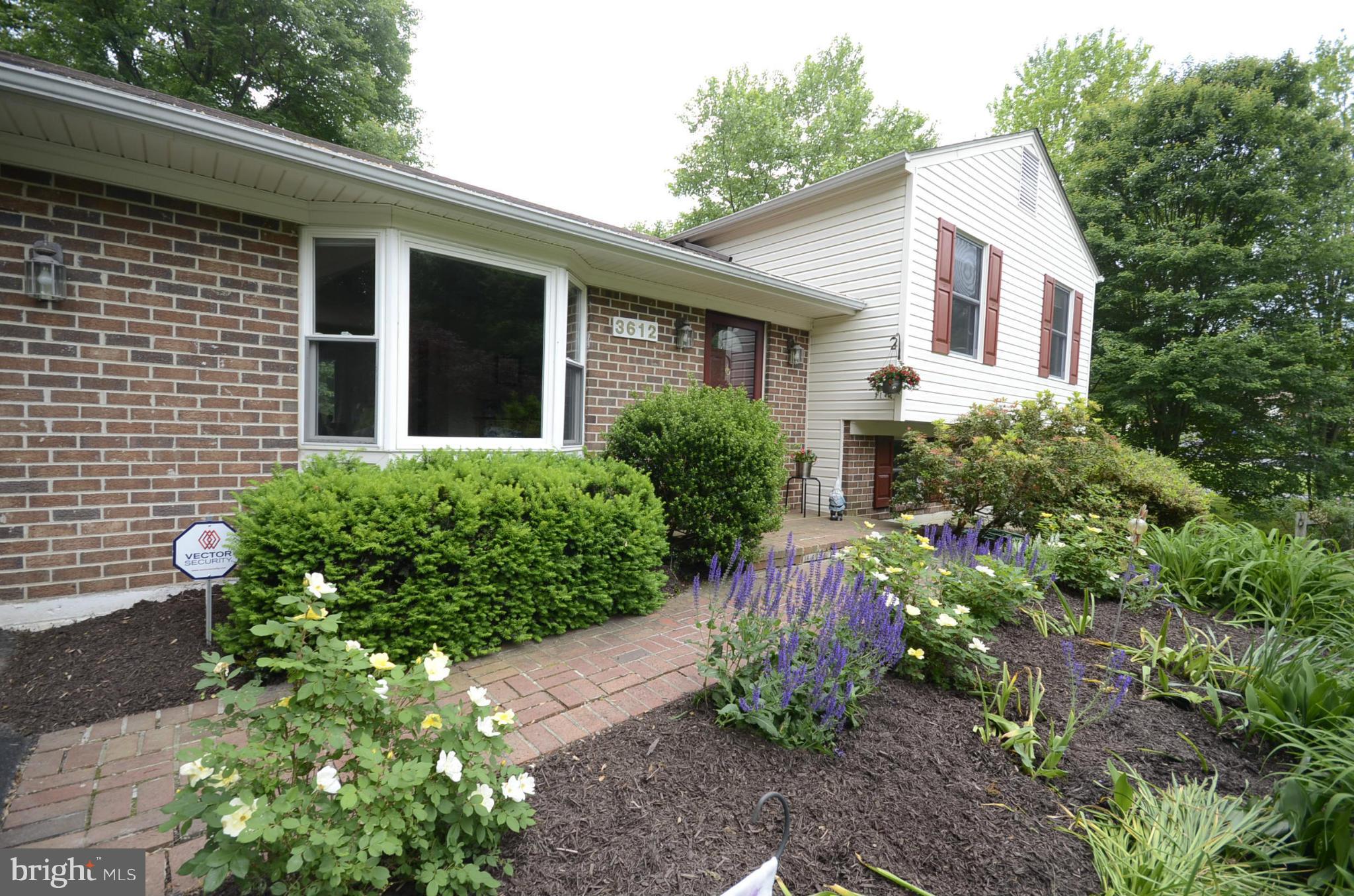 3612 Briars Road Brookeville, MD 20833 - Photo 2 of 21 a front view of a house with a yard