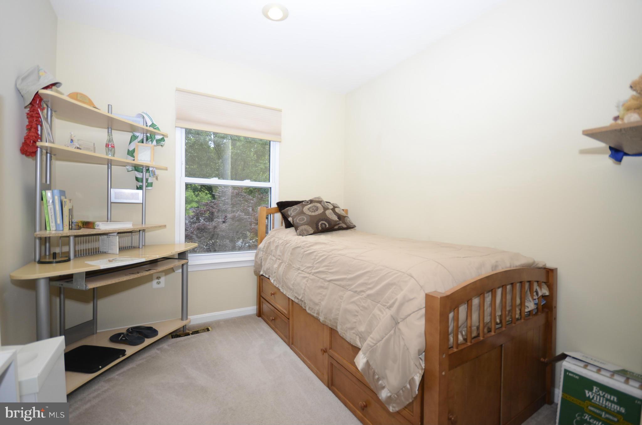 3612 Briars Road Brookeville, MD 20833 - Photo 11 of 21 a bedroom with a bed a desk and a window