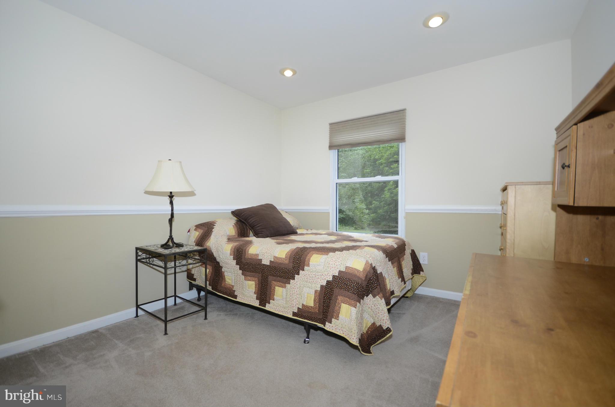 3612 Briars Road Brookeville, MD 20833 - Photo 12 of 21 a bedroom with a bed and a lamp
