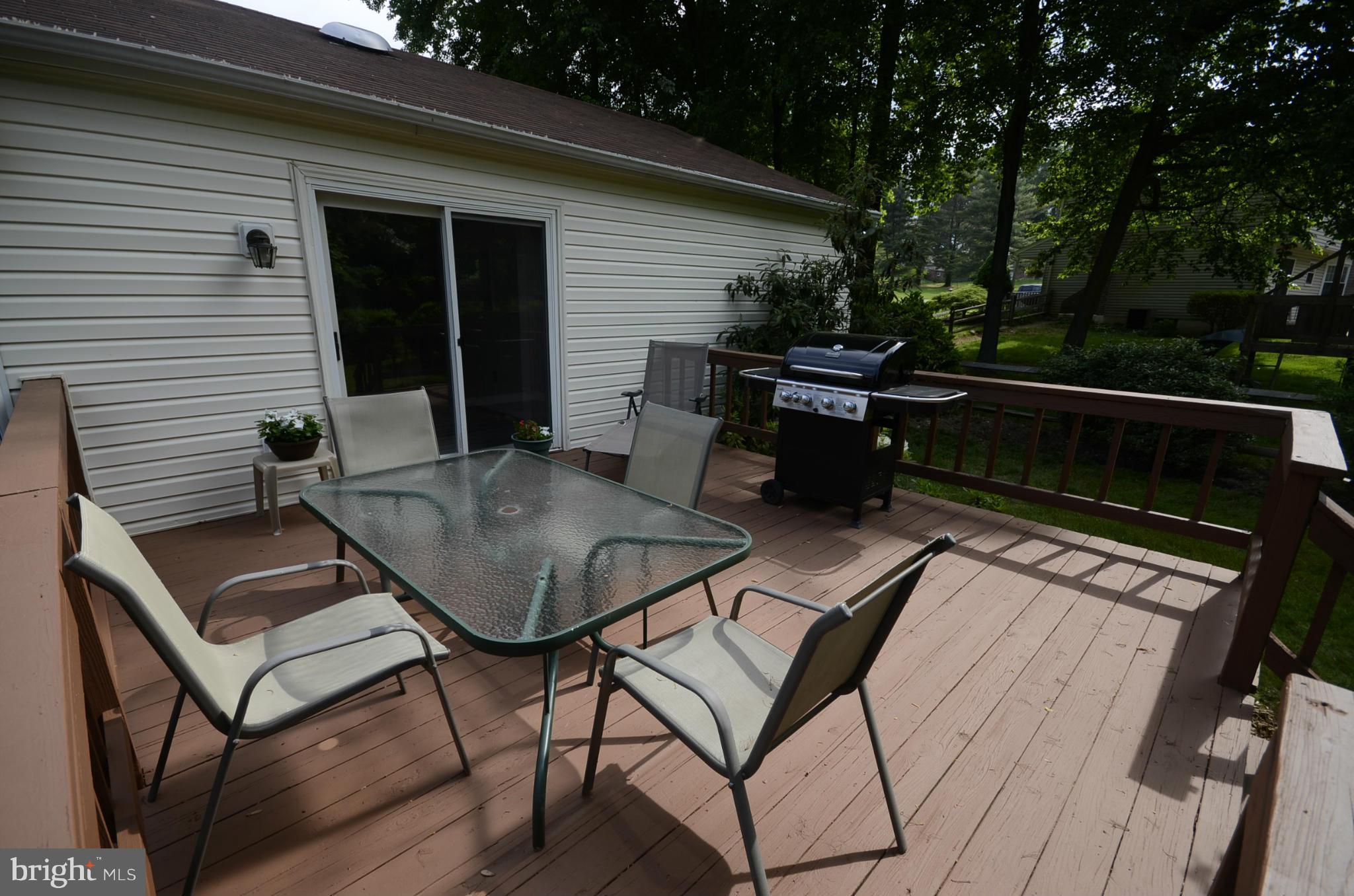 3612 Briars Road Brookeville, MD 20833 - Photo 15 of 21 a backyard of a house with table and chairs