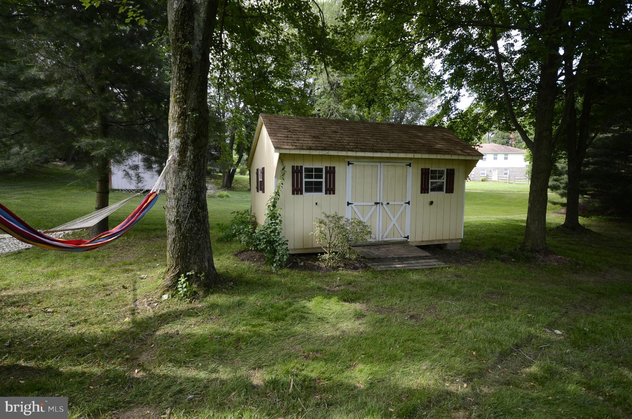 3612 Briars Road Brookeville, MD 20833 - Photo 18 of 21 a view of a house with a backyard