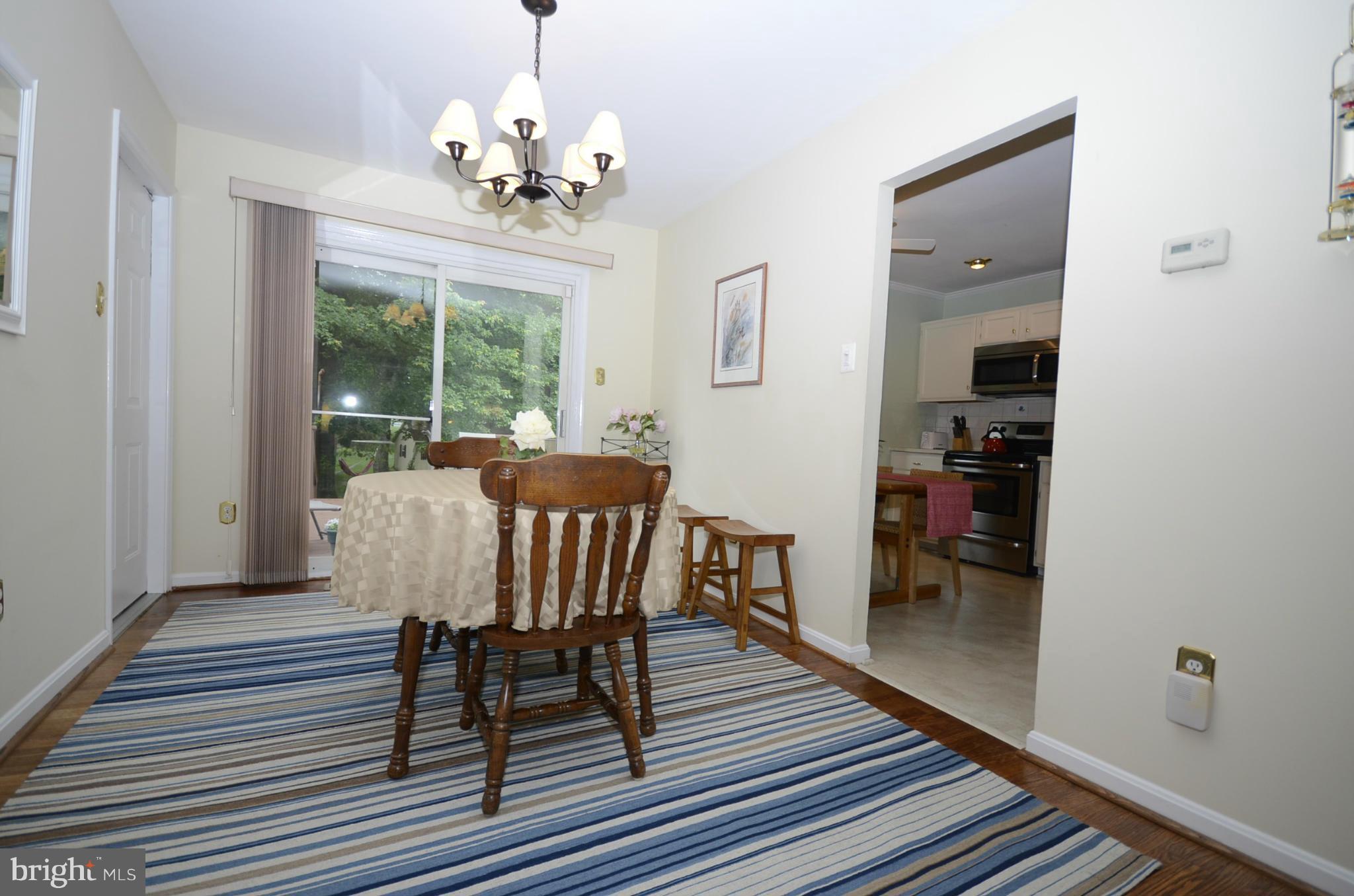 3612 Briars Road Brookeville, MD 20833 - Photo 4 of 21 a view of a dining room with furniture window and wooden floor