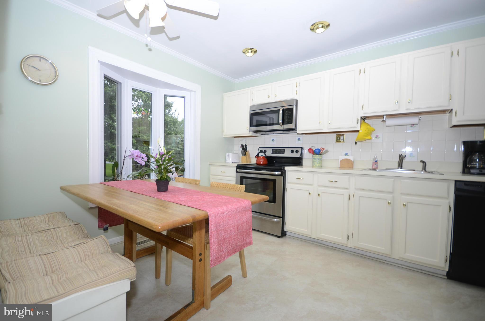 3612 Briars Road Brookeville, MD 20833 - Photo 5 of 21 a kitchen that has a lot of cabinets in it and appliances
