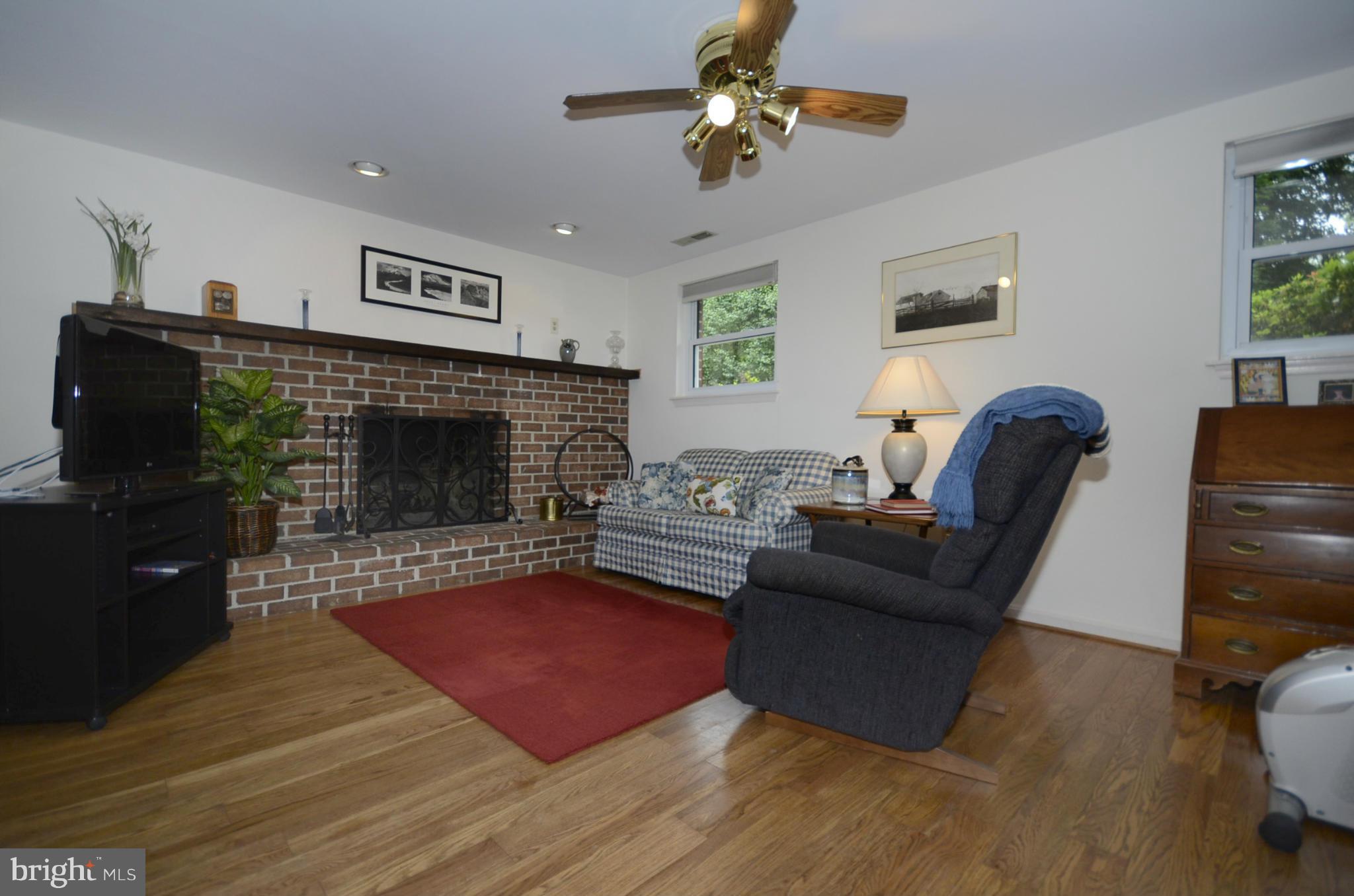 3612 Briars Road Brookeville, MD 20833 - Photo 7 of 21 a living room with furniture and a fireplace