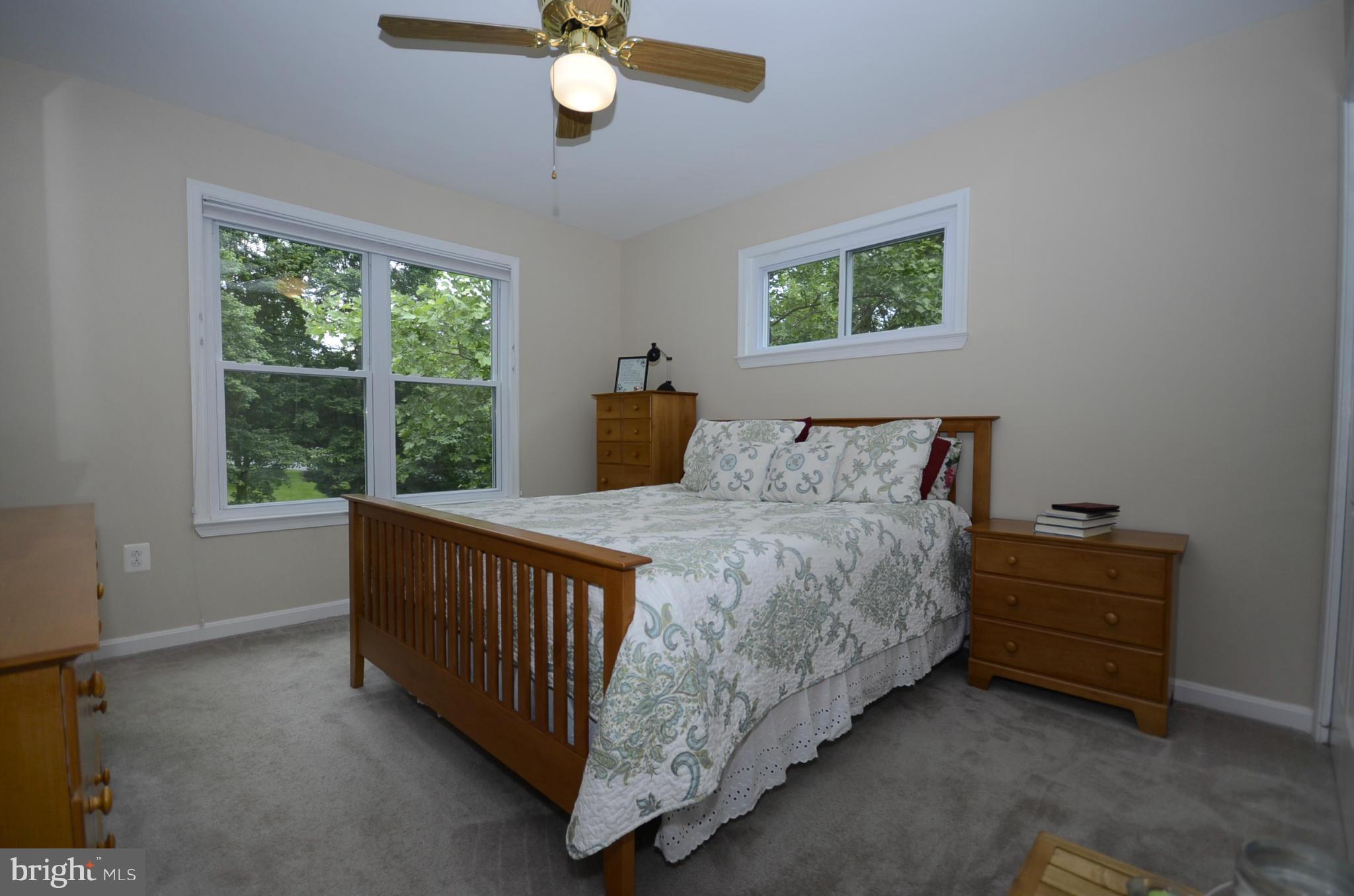 3612 Briars Road Brookeville, MD 20833 - Photo 9 of 21 a bed sitting in a bedroom next to a window