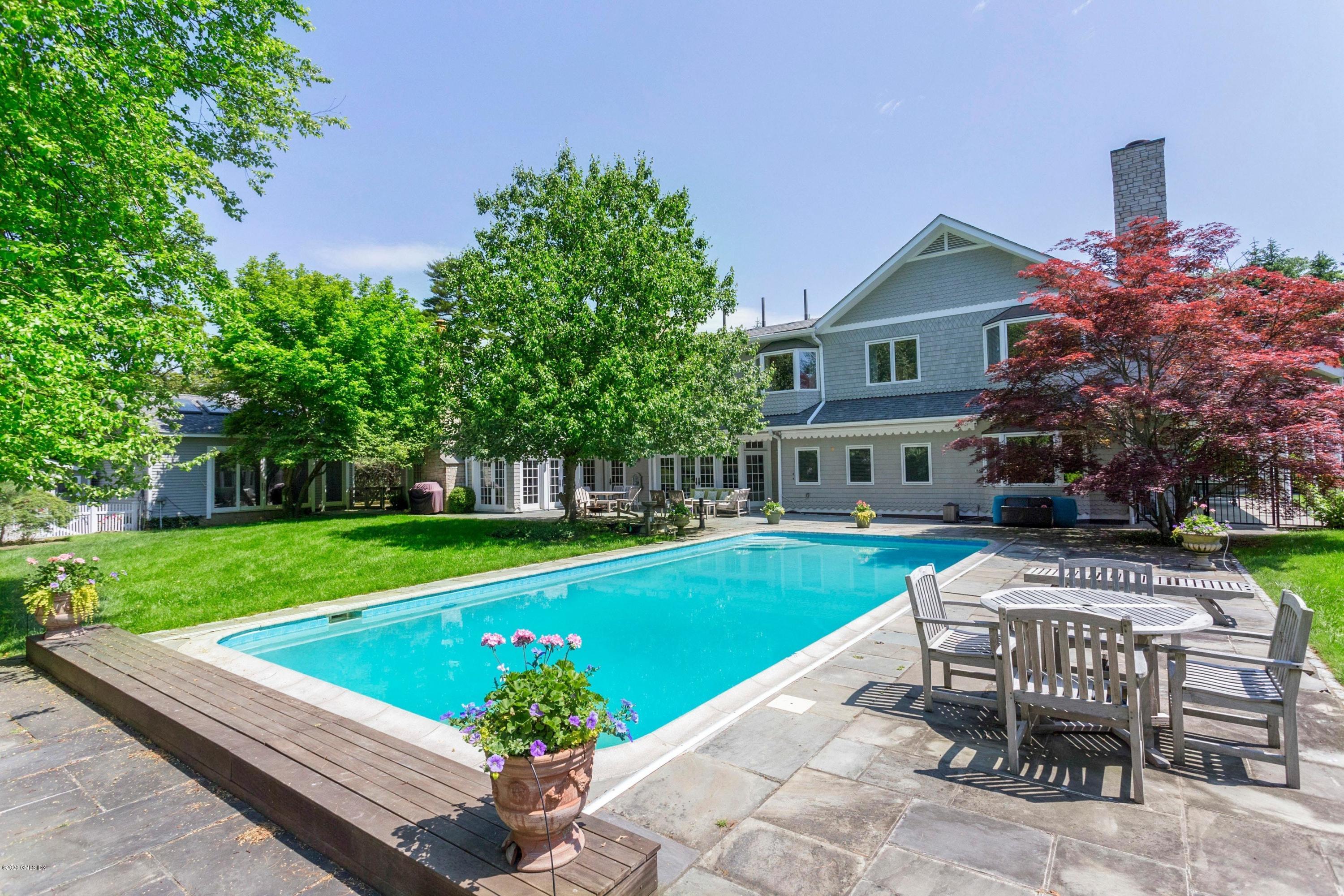 188 Otter Rock Drive Greenwich, CT 06830 - Photo 17 of 23 a view of a house with a yard