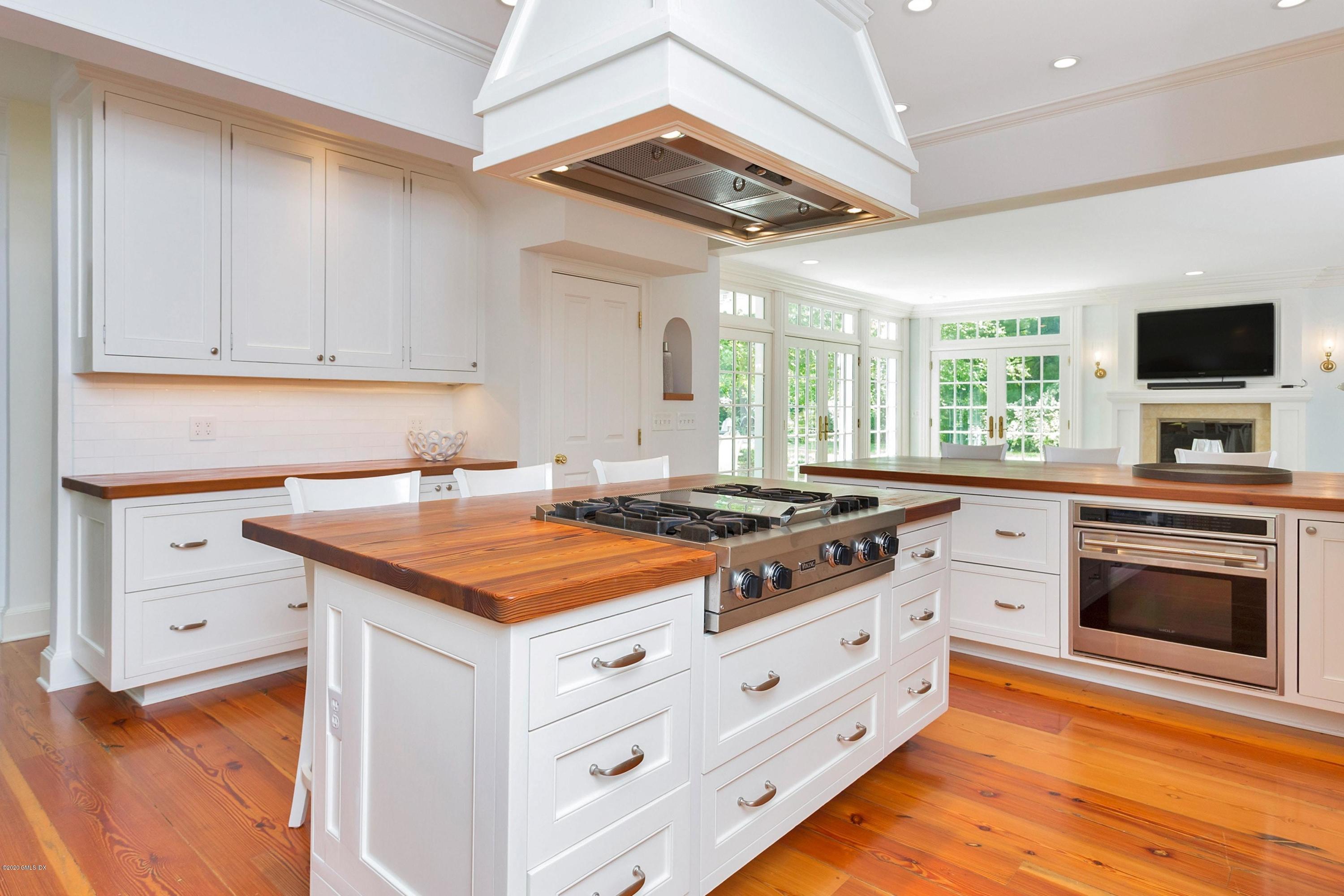 188 Otter Rock Drive Greenwich, CT 06830 - Photo 5 of 23 a kitchen with stainless steel appliances granite countertop a stove and a sink