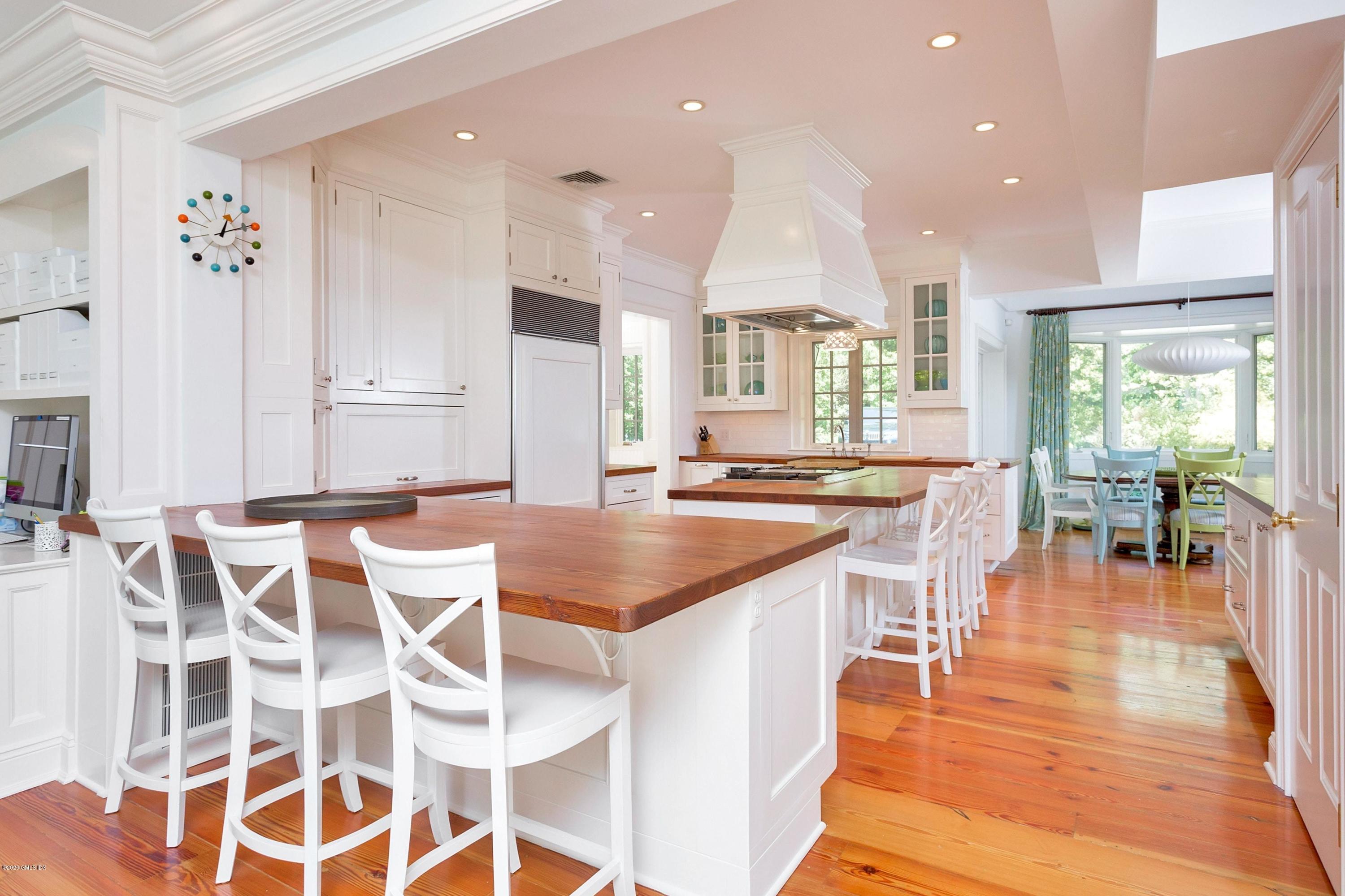 188 Otter Rock Drive Greenwich, CT 06830 - Photo 6 of 23 a large kitchen with lots of counter space and windows