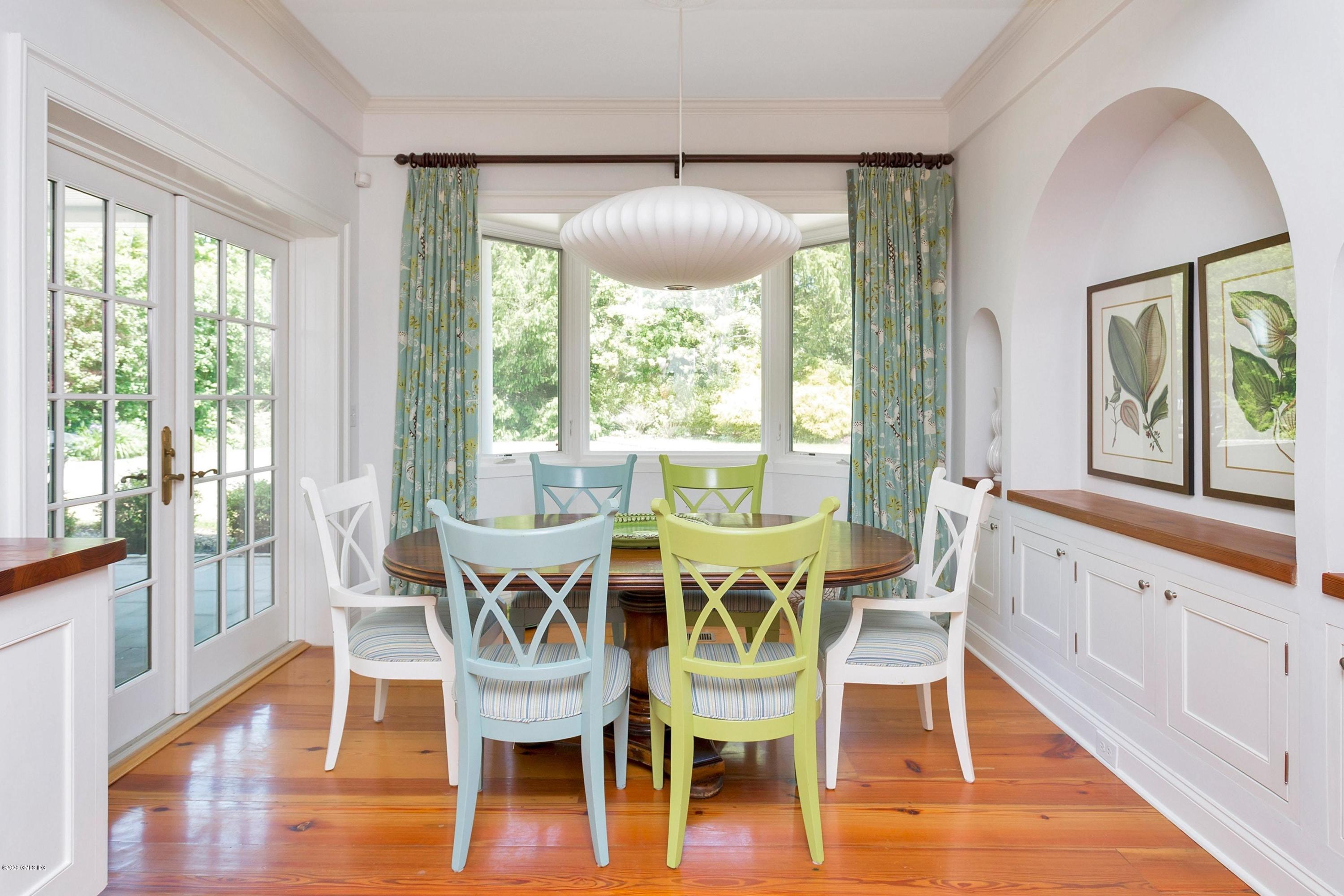 188 Otter Rock Drive Greenwich, CT 06830 - Photo 7 of 23 a view of a dining room with furniture window and wooden floor