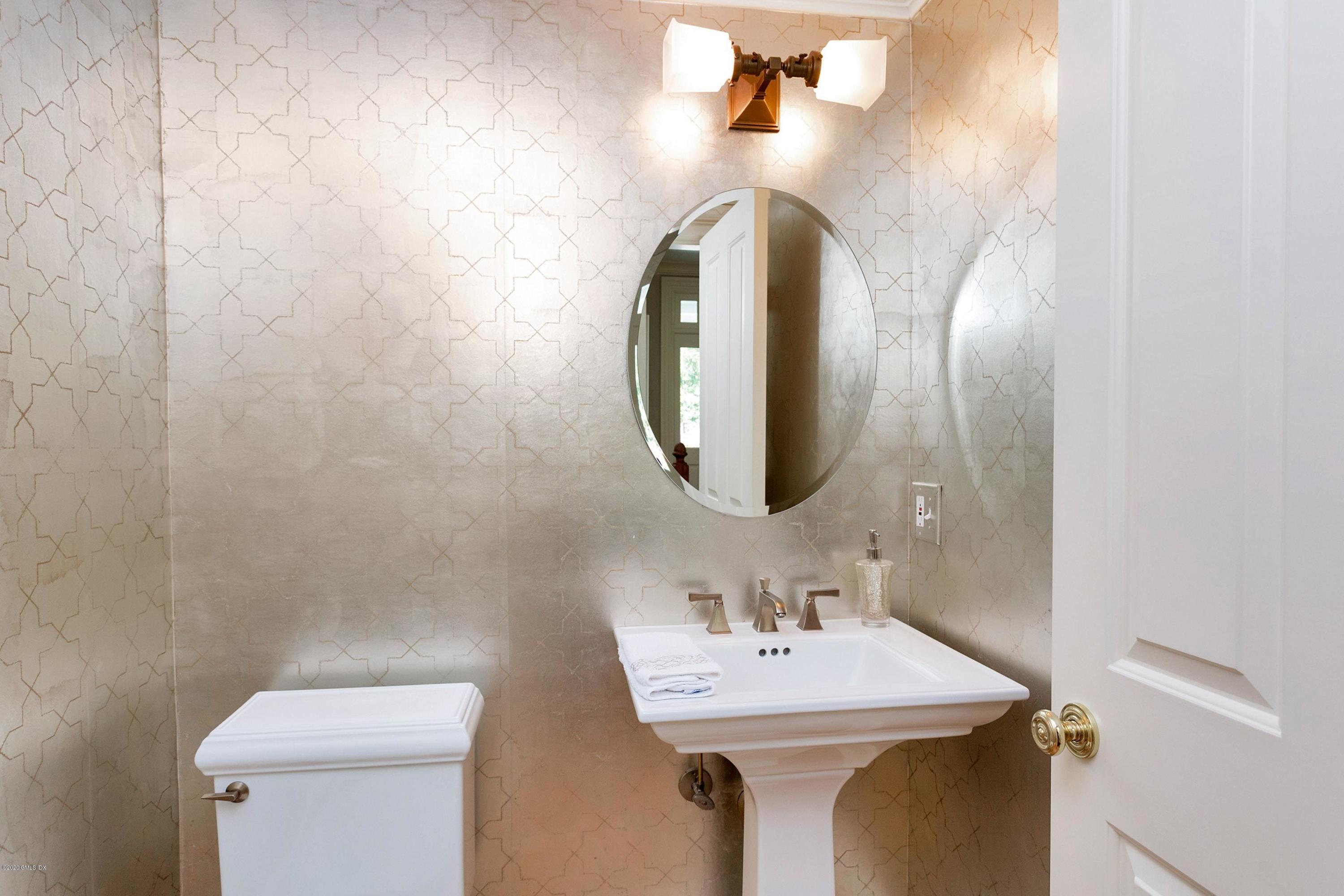 188 Otter Rock Drive Greenwich, CT 06830 - Photo 8 of 23 a bathroom with a sink and a mirror