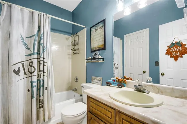 a bedroom with furniture and a bed