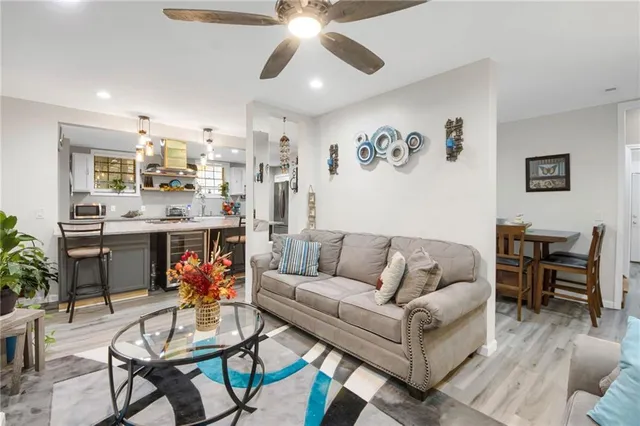 a bathroom with a sink toilet a mirror and shower