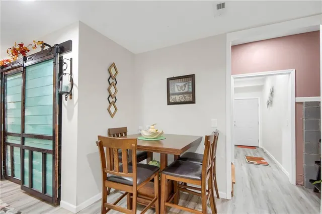 a bedroom with a bed and a lamp