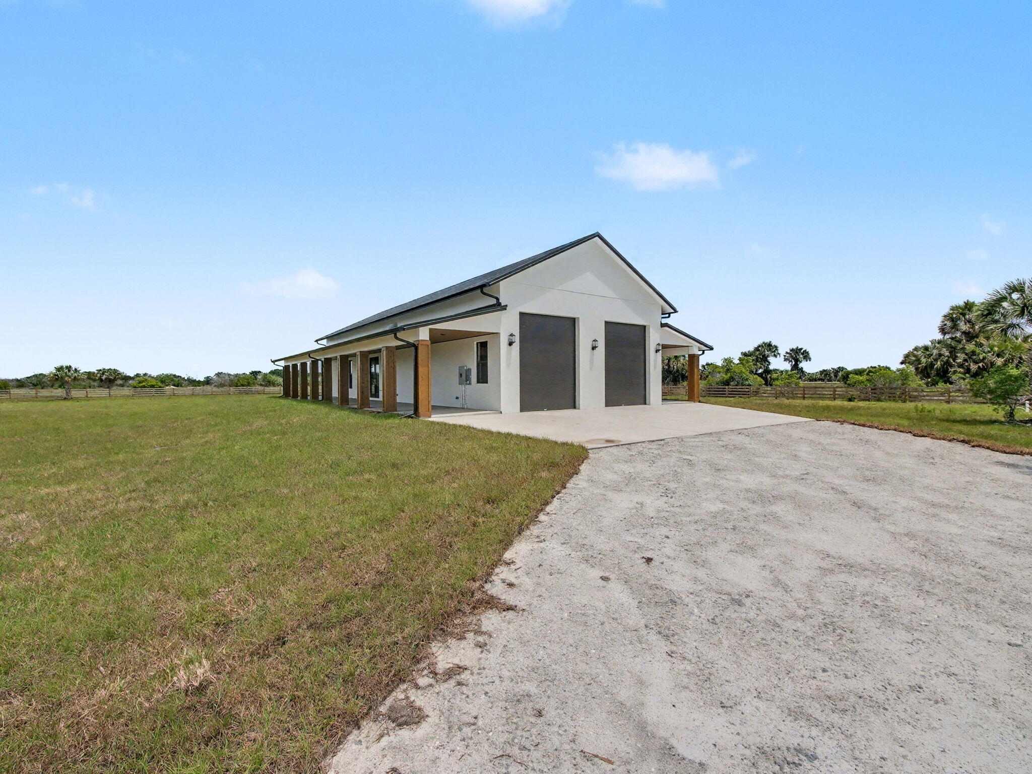 9480 Carlton Road Port St. Lucie, FL 34987 - Photo 13 of 35 a front view of a house with a yard