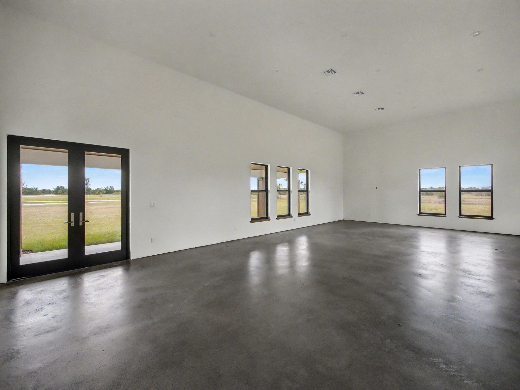 9480 Carlton Road Port St. Lucie, FL 34987 - Photo 15 of 35 a view of a livingroom with wooden floor and window