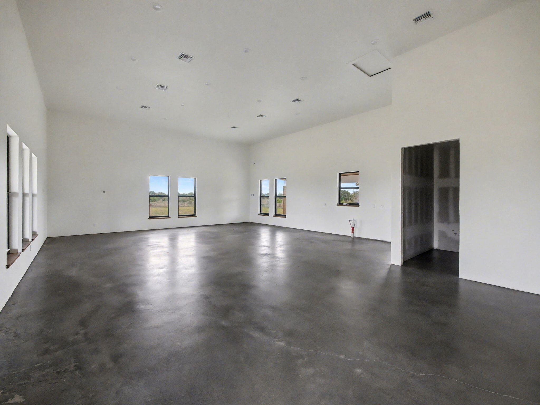9480 Carlton Road Port St. Lucie, FL 34987 - Photo 16 of 35 a view of a livingroom with wooden floor