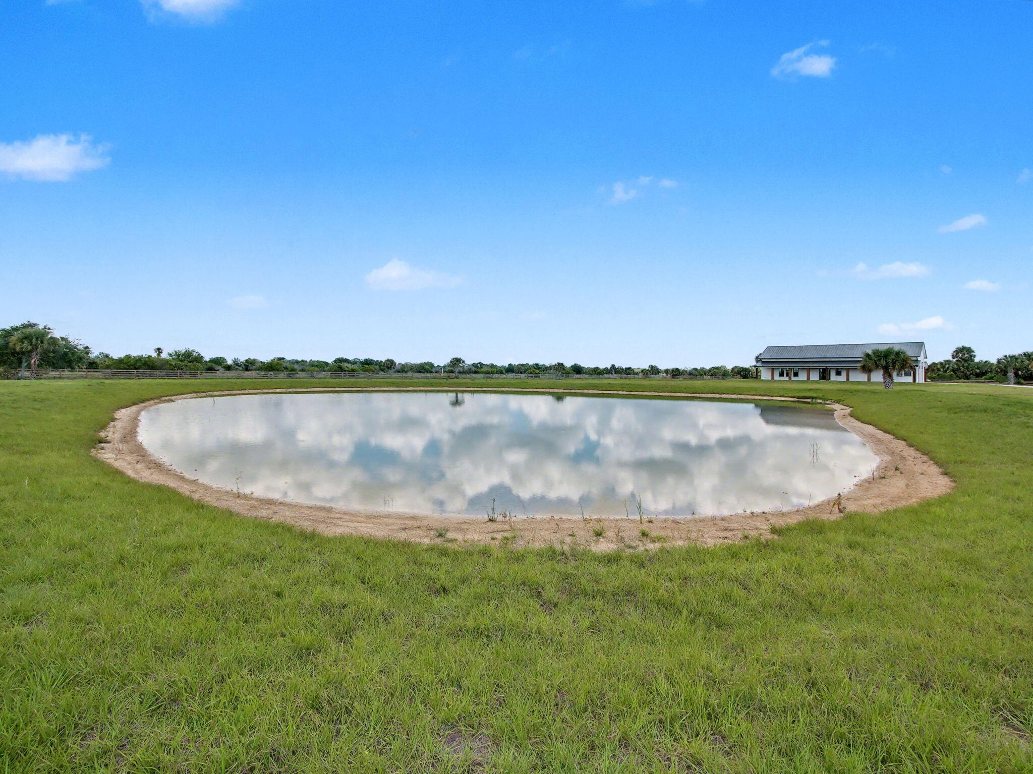 9480 Carlton Road Port St. Lucie, FL 34987 - Photo 28 of 35 a view of a swimming pool and a yard
