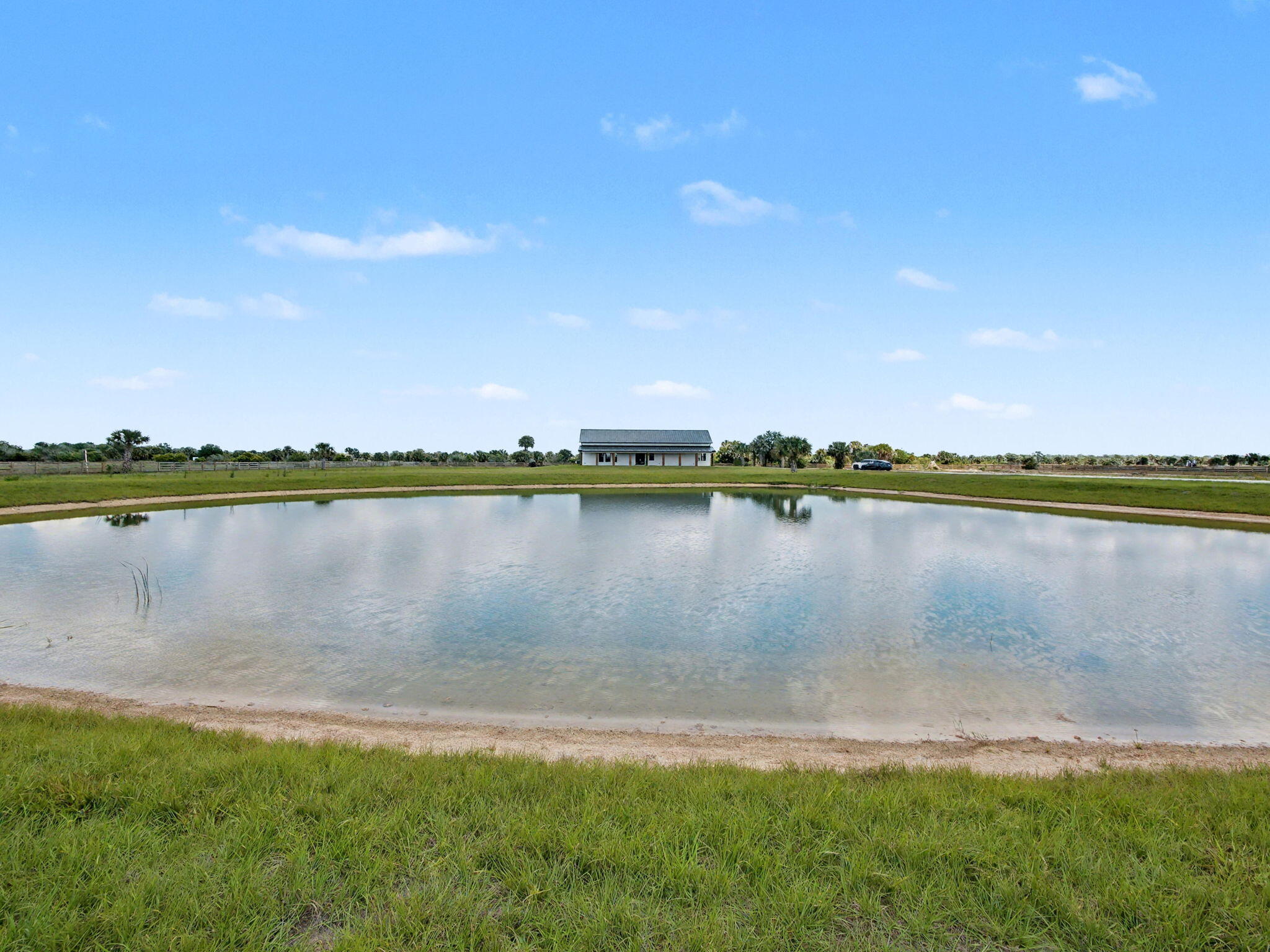 9480 Carlton Road Port St. Lucie, FL 34987 - Photo 29 of 35 a view of a lake with a big yard
