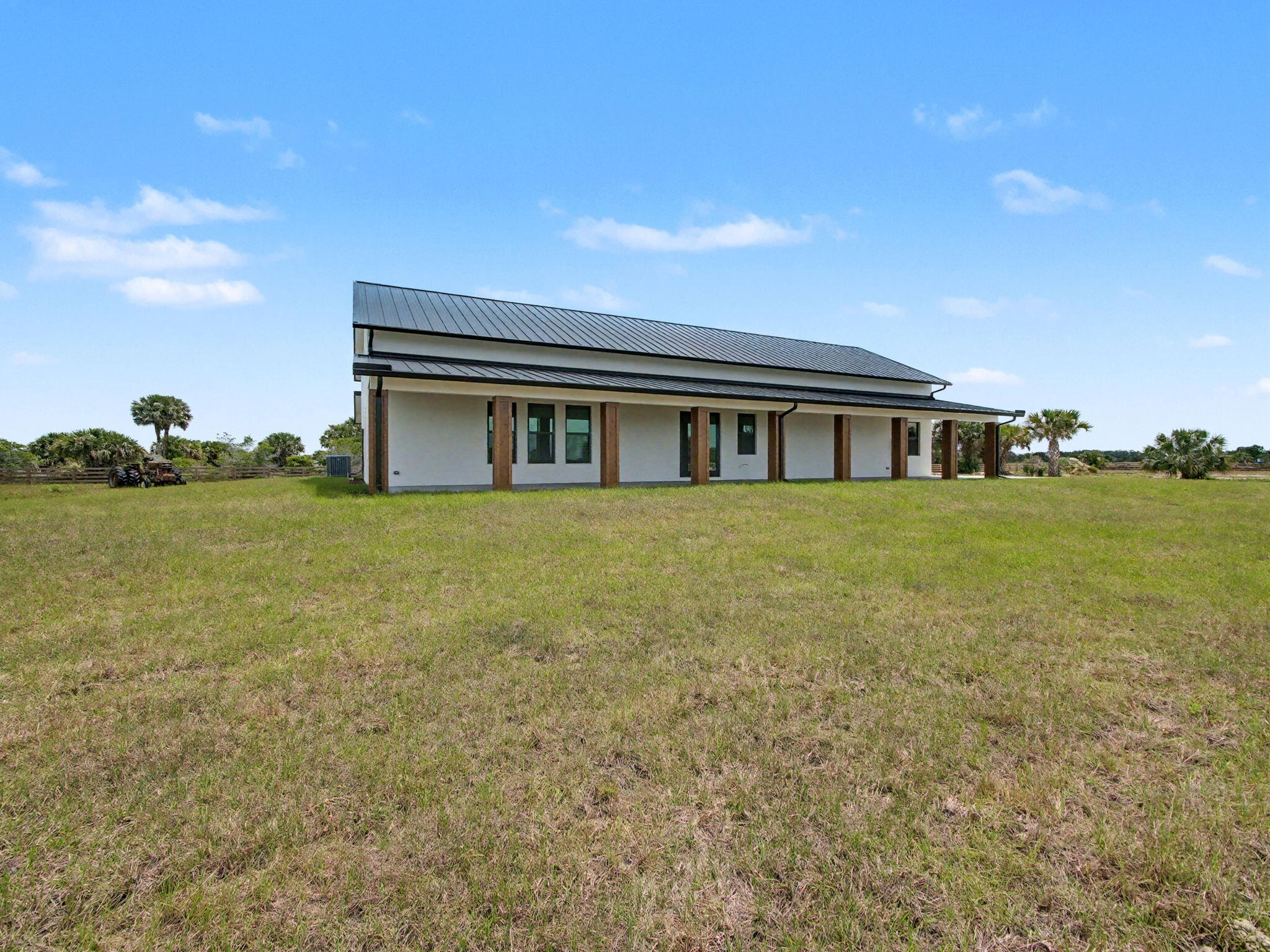 9480 Carlton Road Port St. Lucie, FL 34987 - Photo 31 of 35 a view of a house with a big yard