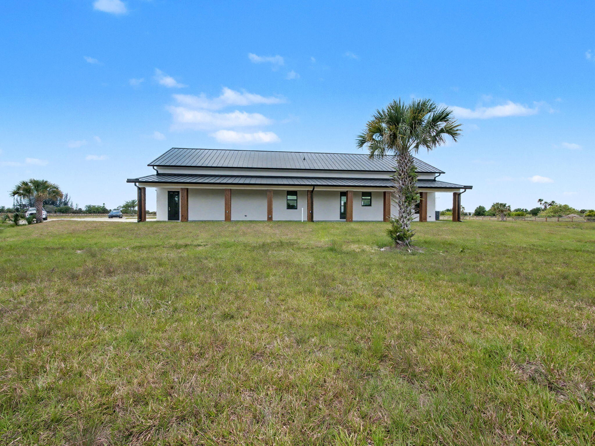 9480 Carlton Road Port St. Lucie, FL 34987 - Photo 32 of 35 a house view with a garden space