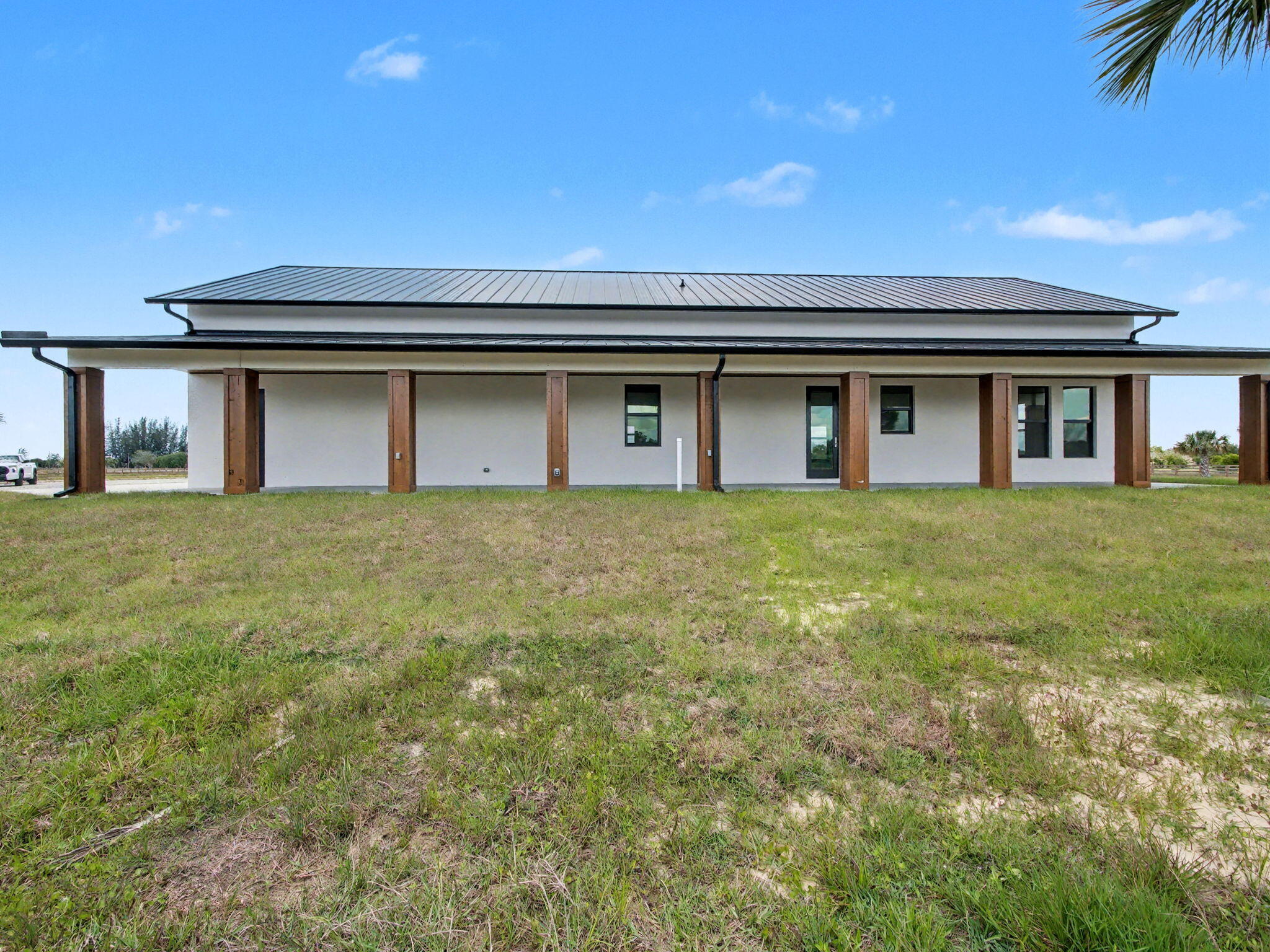 9480 Carlton Road Port St. Lucie, FL 34987 - Photo 33 of 35 a house view with a garden space
