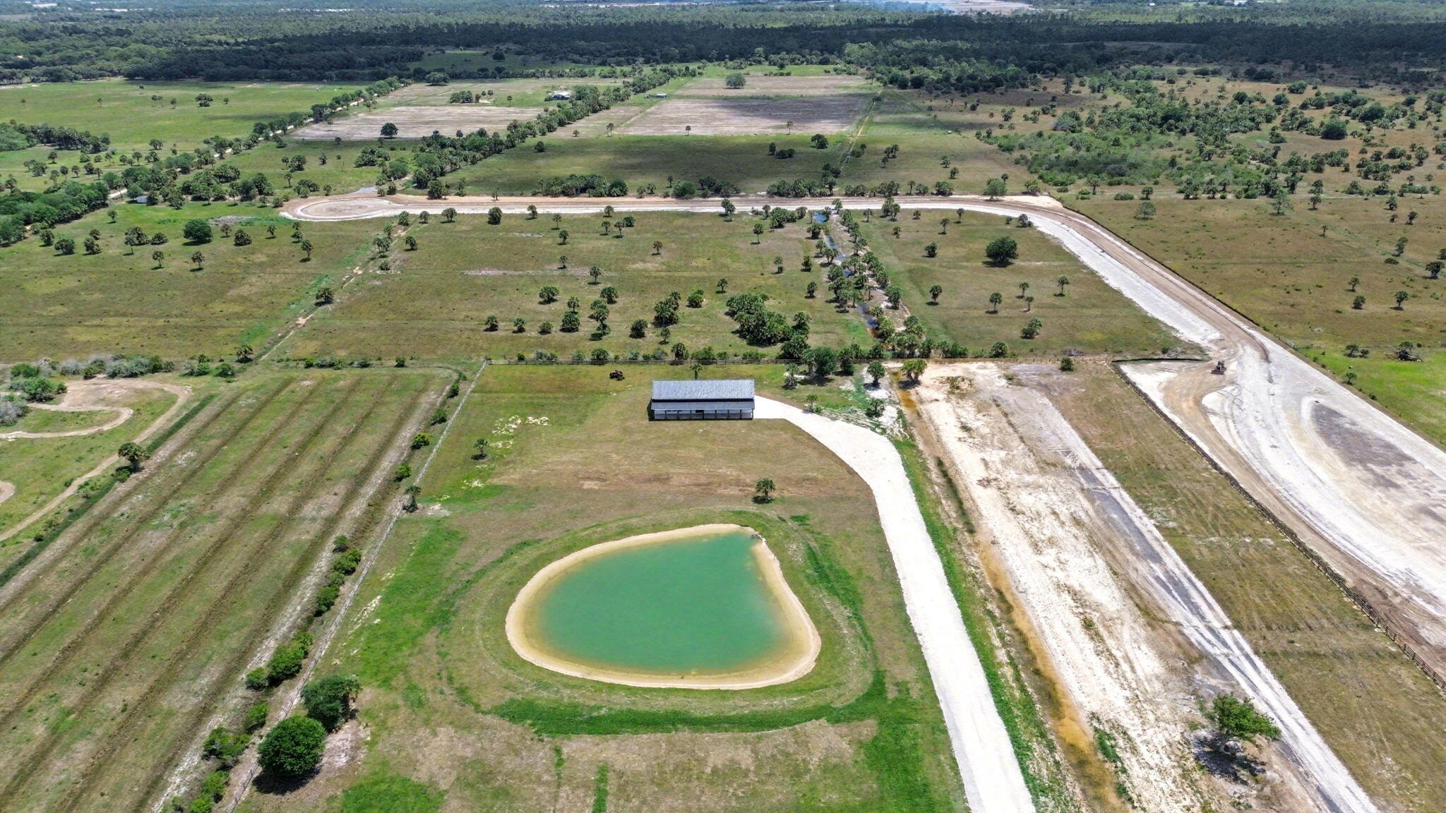 9480 Carlton Road Port St. Lucie, FL 34987 - Photo 7 of 35 a view of a swimming pool and a yard