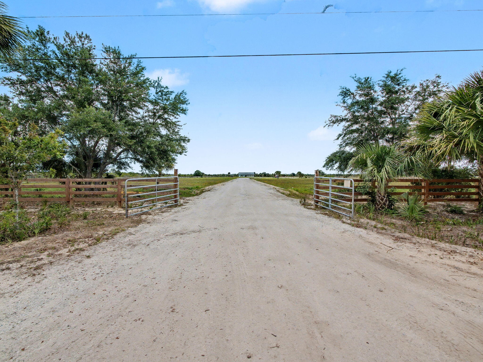 9480 Carlton Road Port St. Lucie, FL 34987 - Photo 8 of 35 a view of a road with a ground