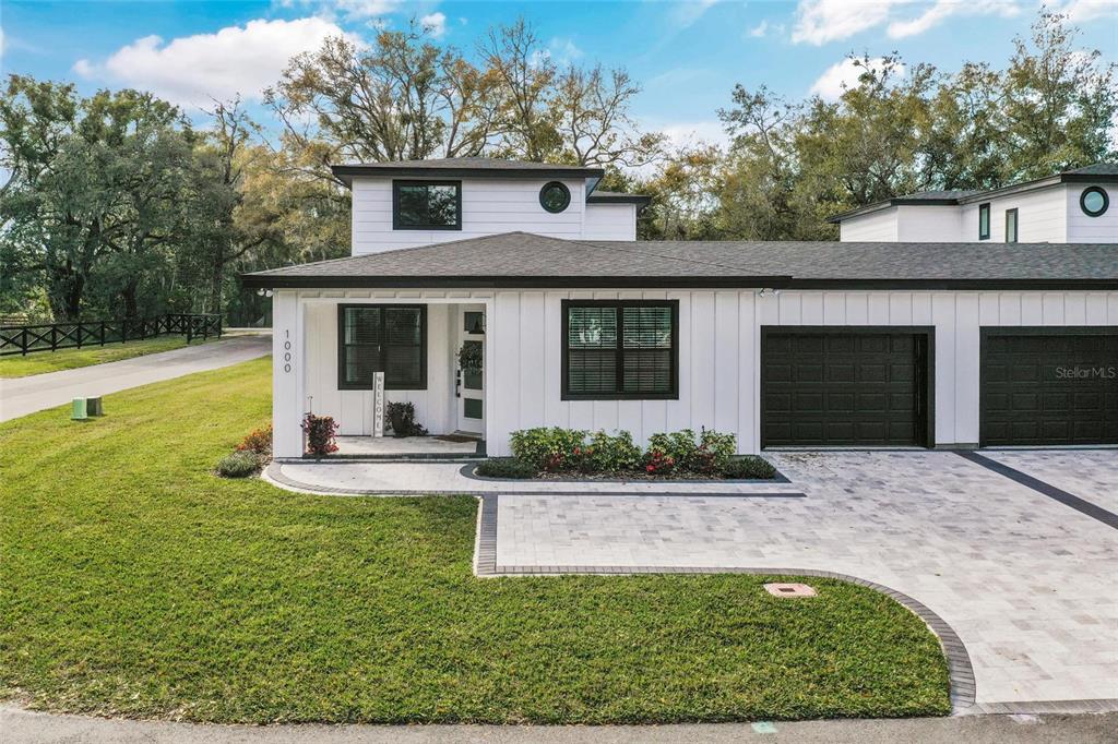 a front view of a house with garden