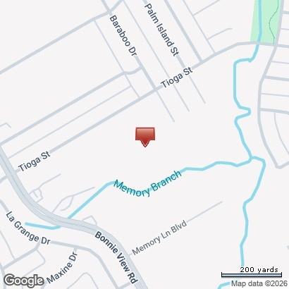 6540 No Name Street, Unit 6540 Dallas, TX 75241 - Photo 3 of 3 a picture of a room with a white bed and a chair