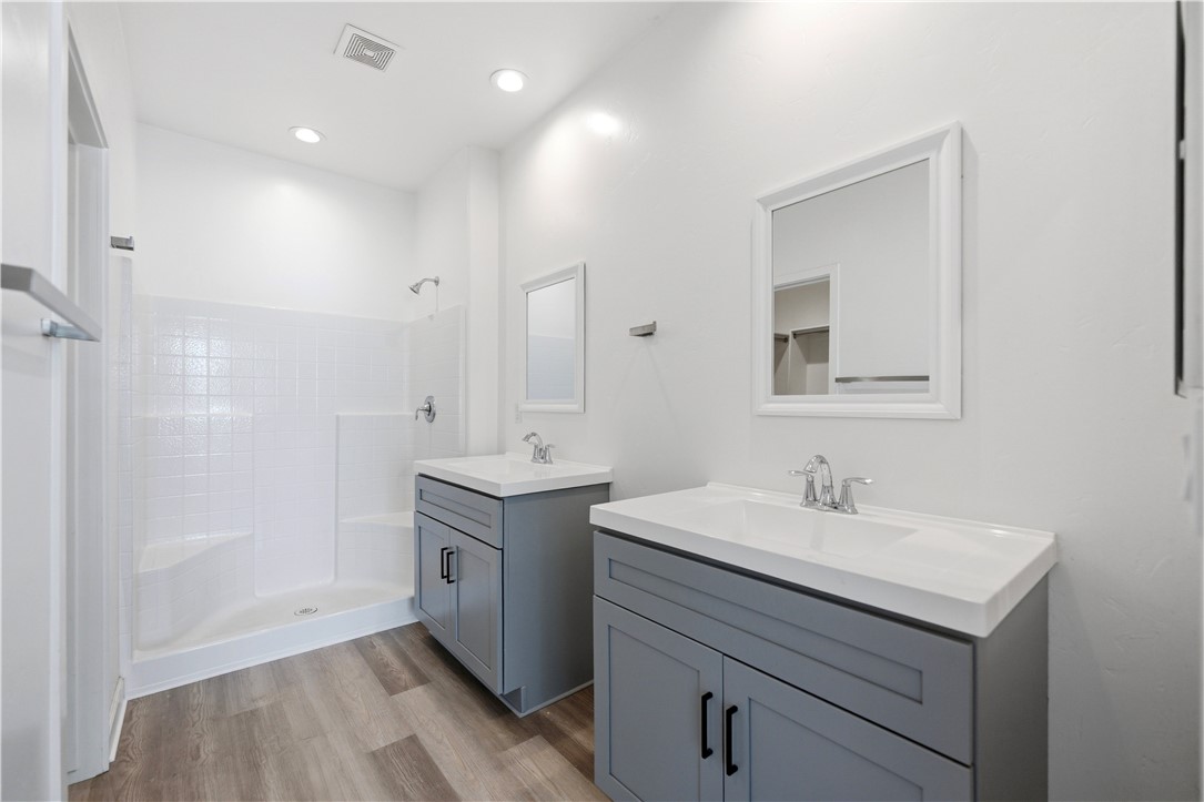 3546 North Skylark Road Kingman, AZ 86409 - Photo 7 of 30 a bathroom with a sink a mirror and a shower
