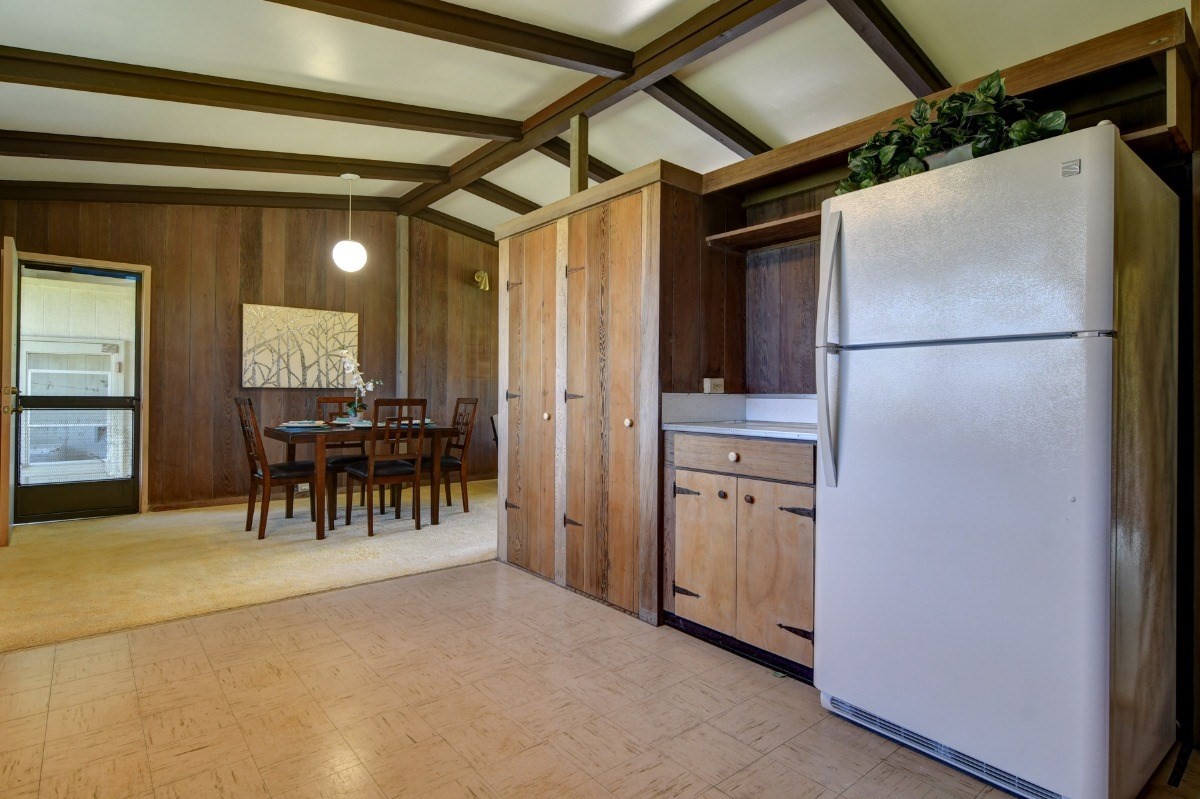 50 B Malaai Road Hilo, HI 96720 - Photo 17 of 30 a kitchen with refrigerator and table