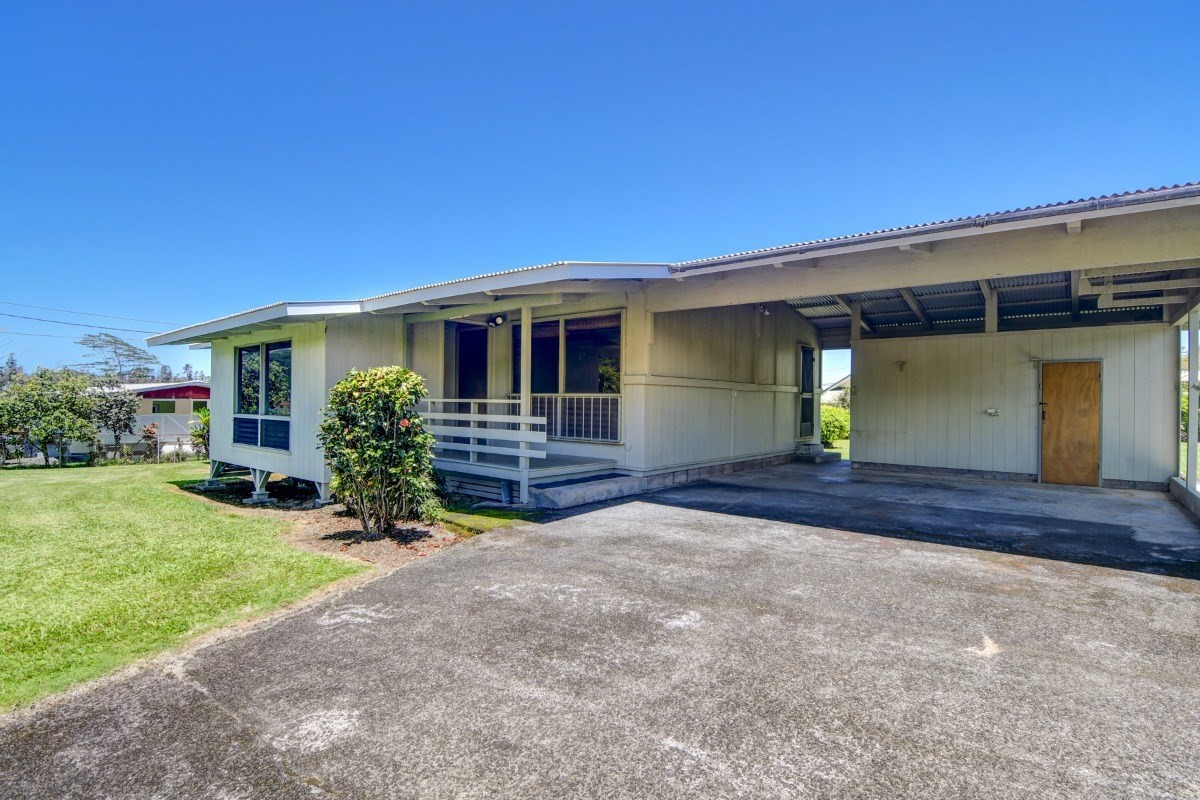 50 B Malaai Road Hilo, HI 96720 - Photo 3 of 30 a view of a house with a yard and garage