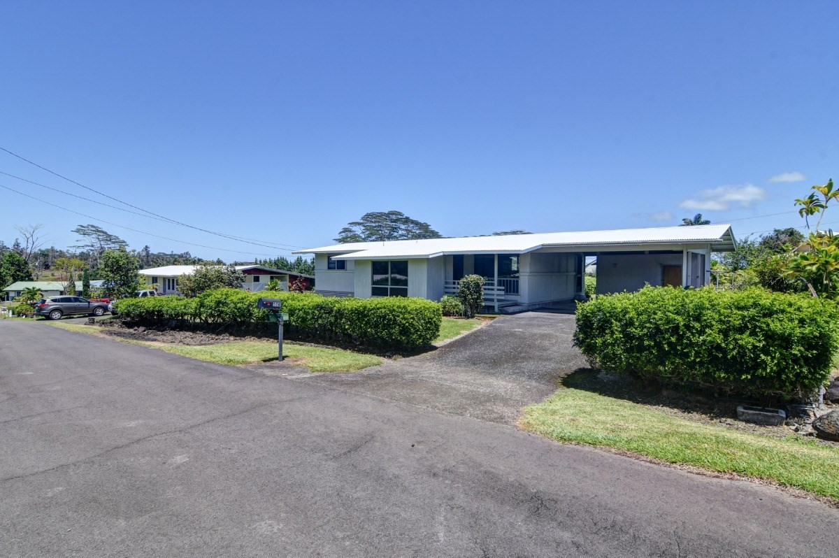 50 B Malaai Road Hilo, HI 96720 - Photo 10 of 30 a view of a house with a street and a yard