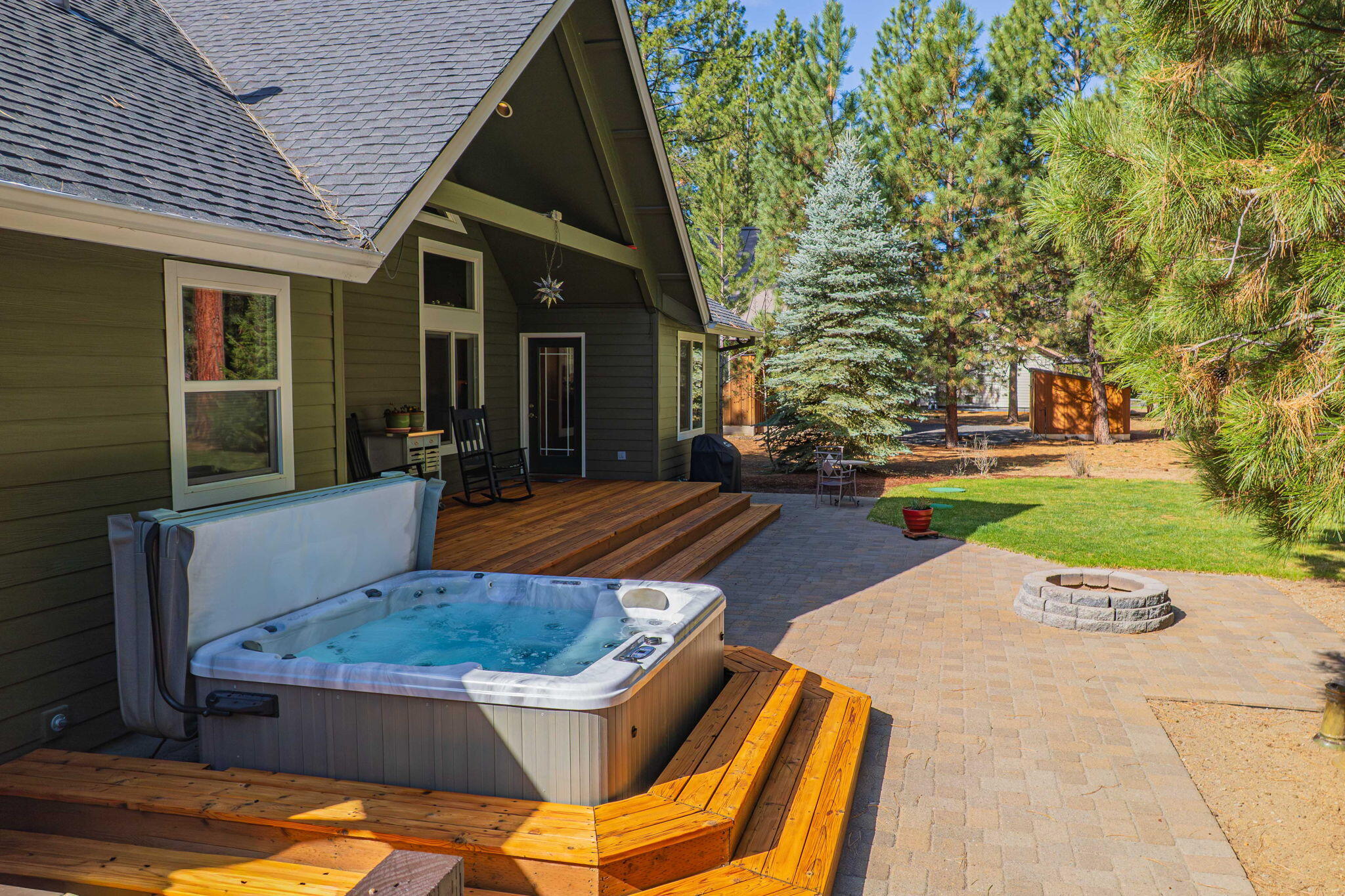 14234 Whitewater Loop La Pine, OR 97739 - Photo 3 of 62 Newer Hot tub (2022) and paver patio with a fire pit
