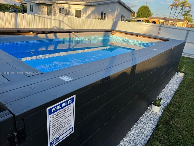a view of a balcony with two chairs